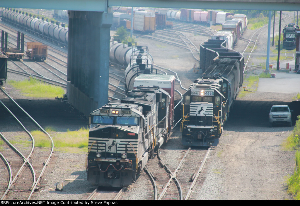 NS 9821 leads train 27N out of Enola yard past a switcher set